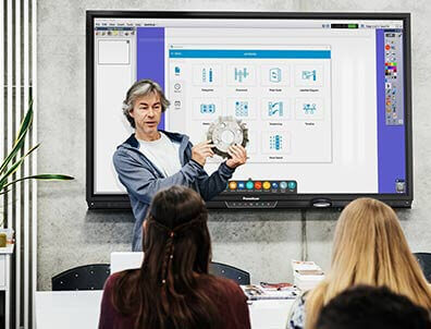 Teacher using ActivPanel in a high school classroom.