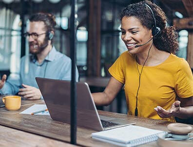 woman on a phone call using a laptop. 