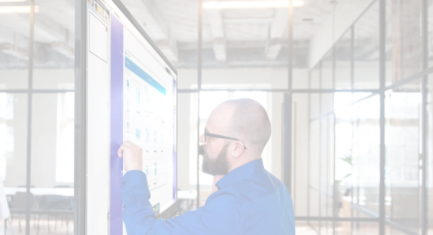 Man using an interactive display in a conference room