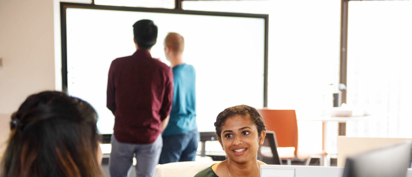 Office environment containing an interactive display. 