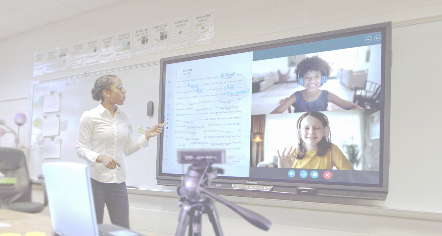 teacher using ActivPanel for distance learning with students on screen who are at home. 
