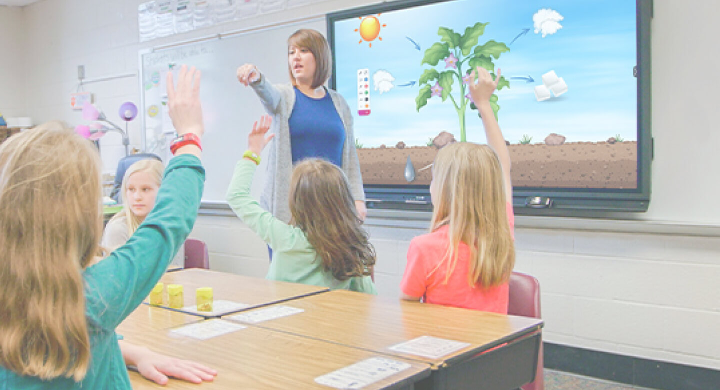 teacher using ActivPanel in an elementary school classroom