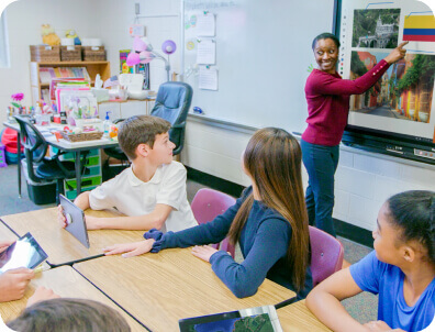 students in a classroom with an ActivPanel. 