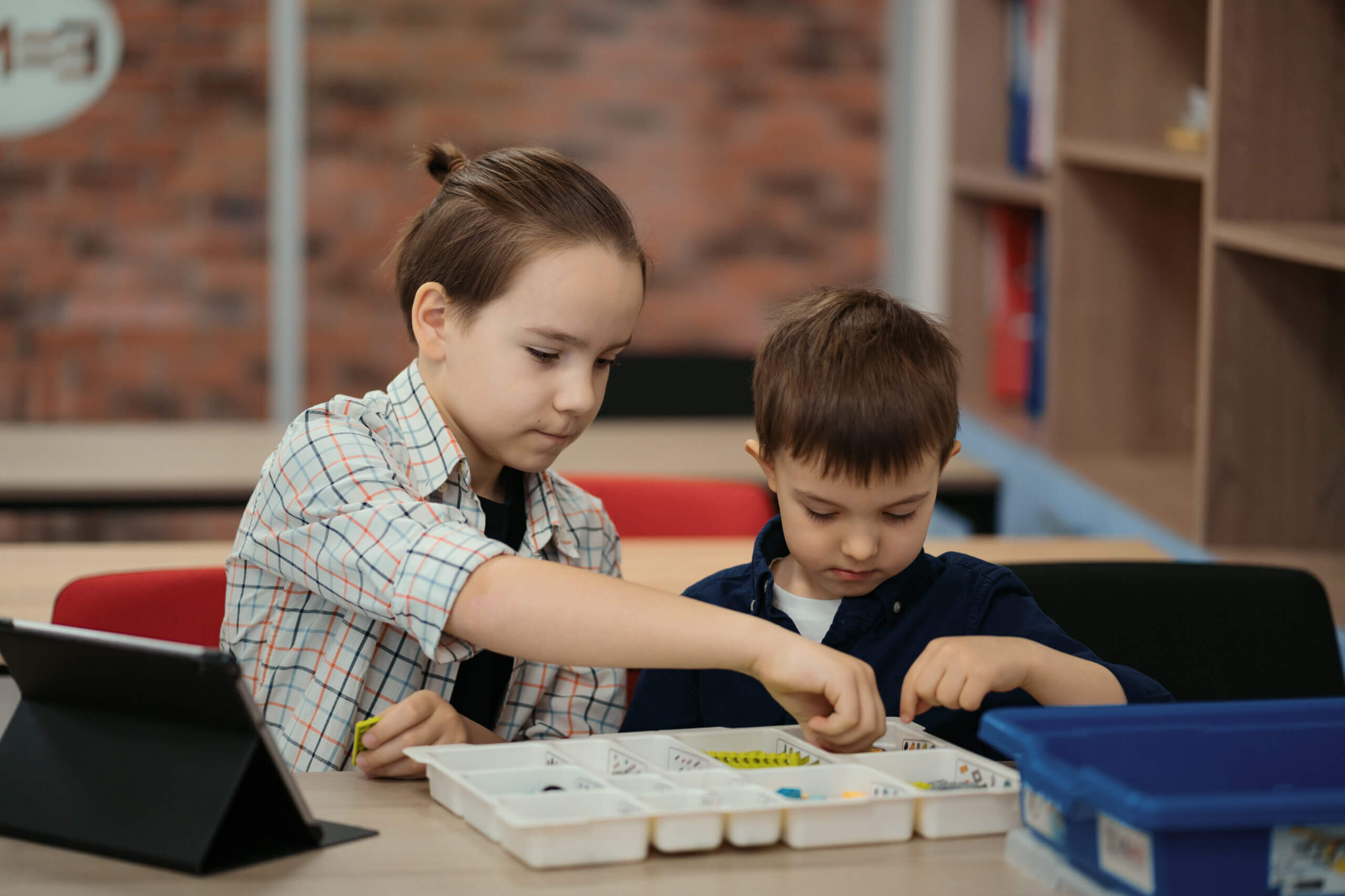 two KS2 students play a science game in the classroom