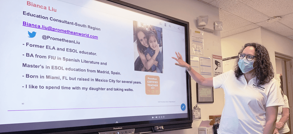 teacher teaching students using an interactive whiteboard