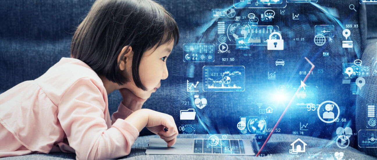 young girl on a laptop displaying the world of computing