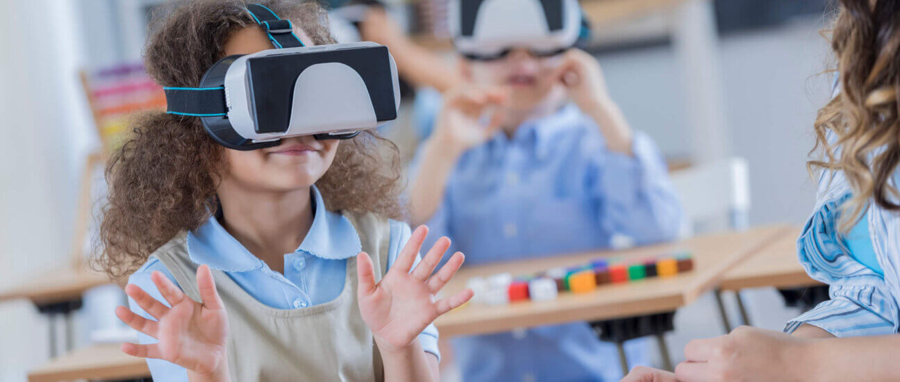 Young student with virtual reality glasses in the classroom