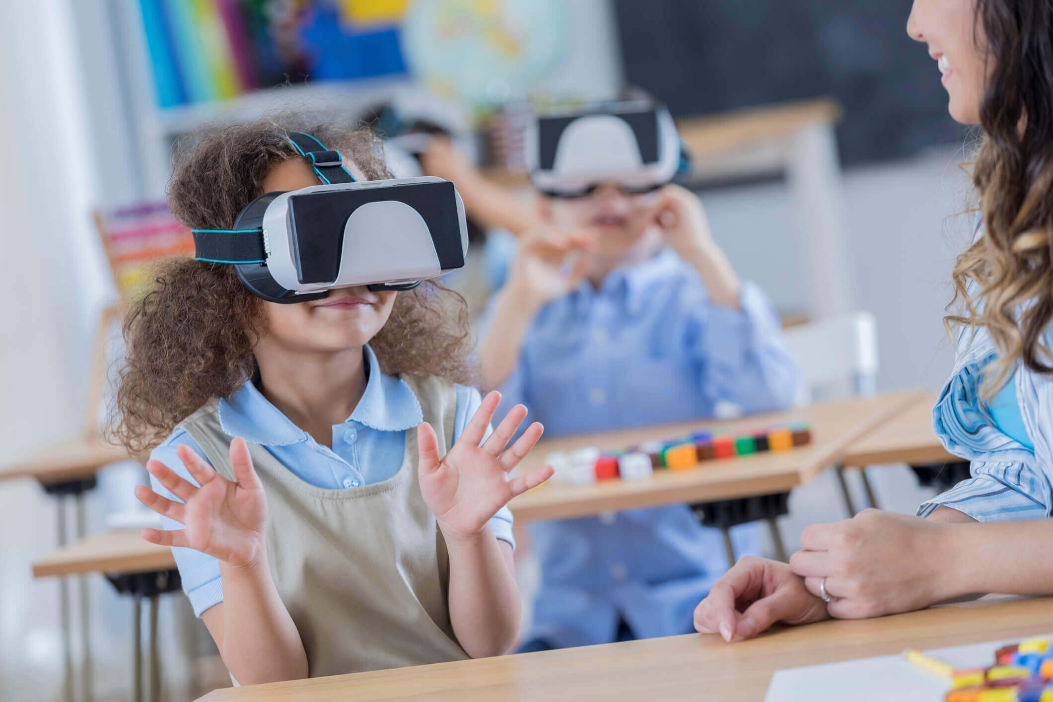 Young student with virtual reality glasses in the classroom