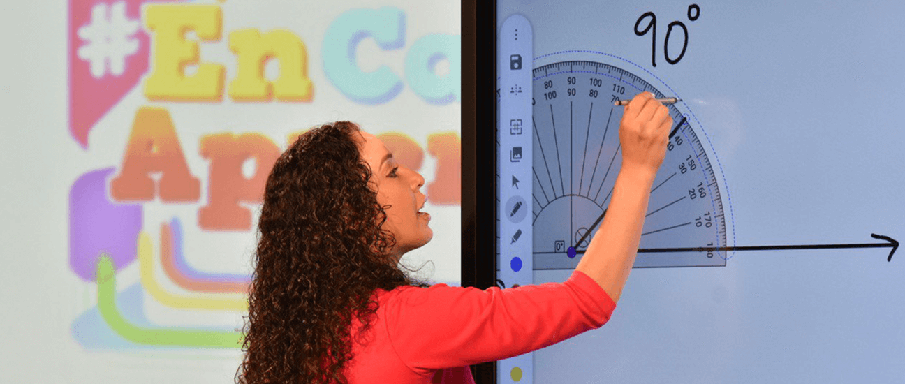 Woman using an ActivPanel during class instruction