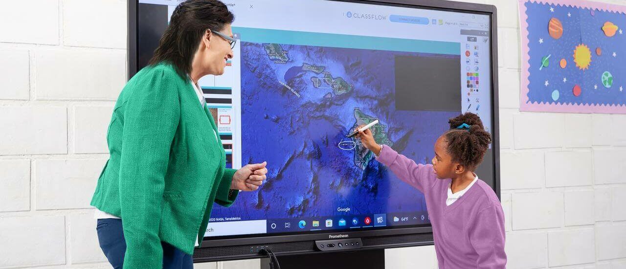 student and teacher using an interactive whiteboard in the classroom