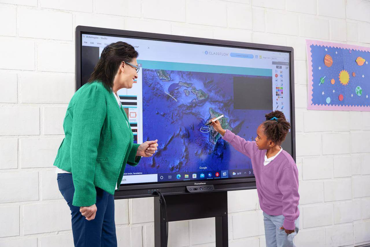 student and teacher using an interactive whiteboard in the classroom