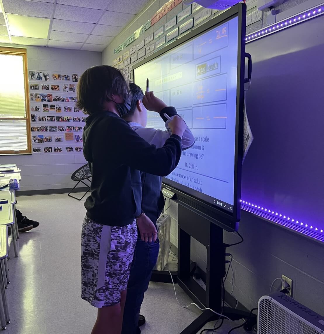 students engaging with ActivPanel in the classroom. 