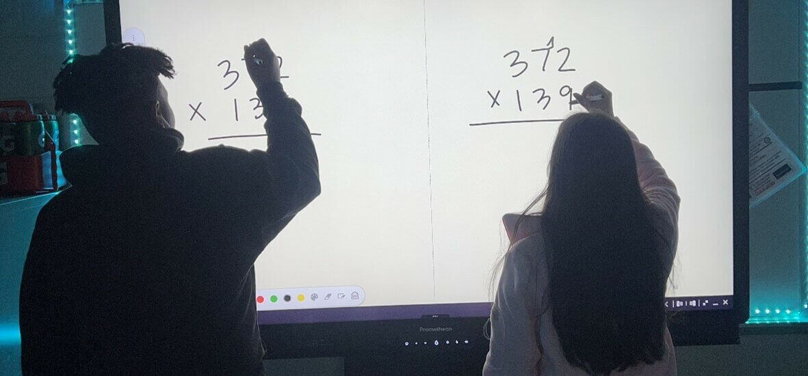 Students using ActivPanel in the classroom.