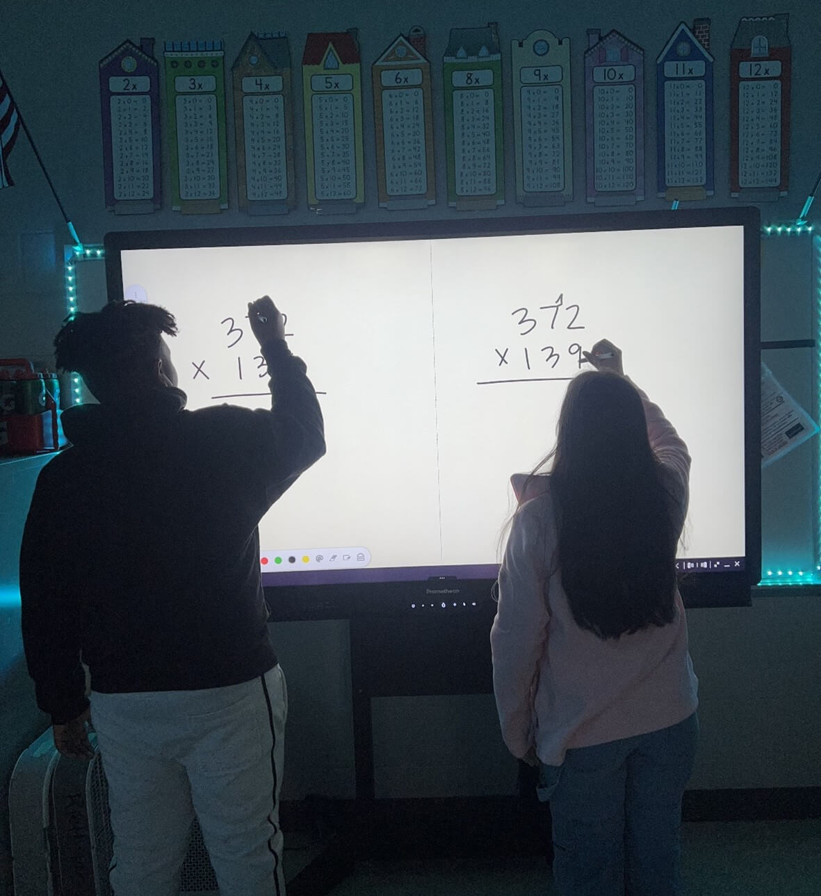 Students using ActivPanel in the classroom.