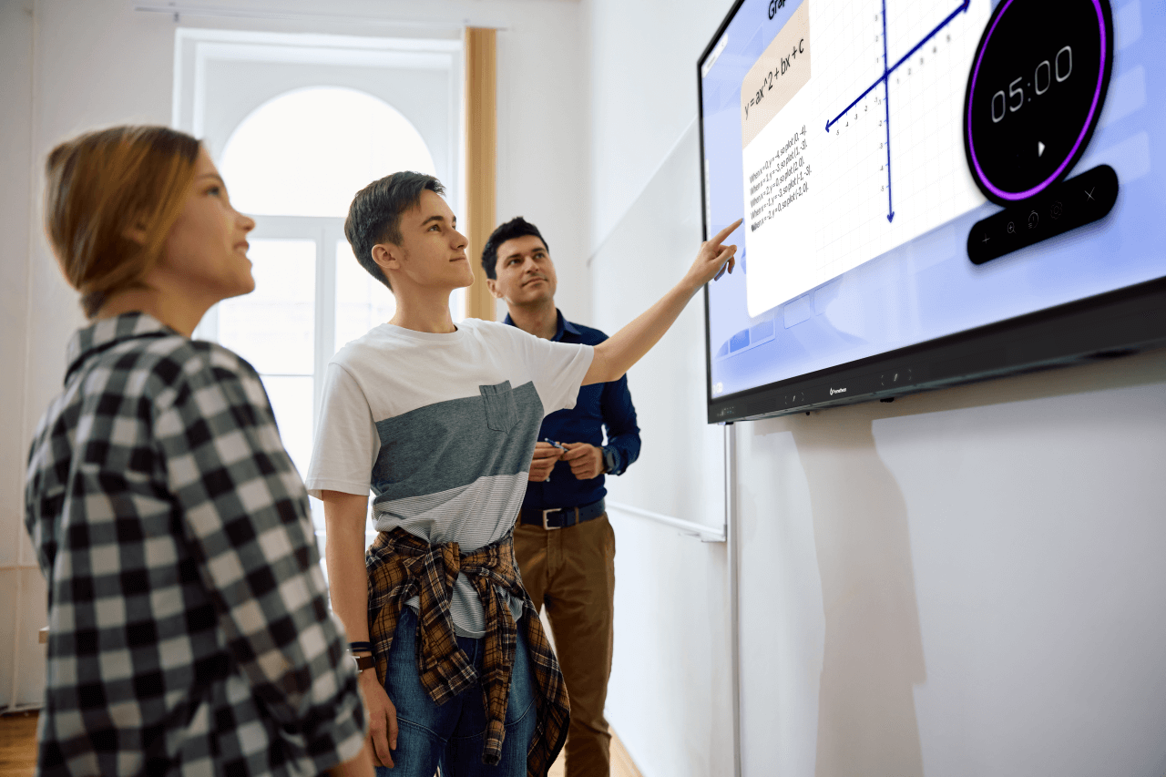 three people interacting with the ActivPanel LE