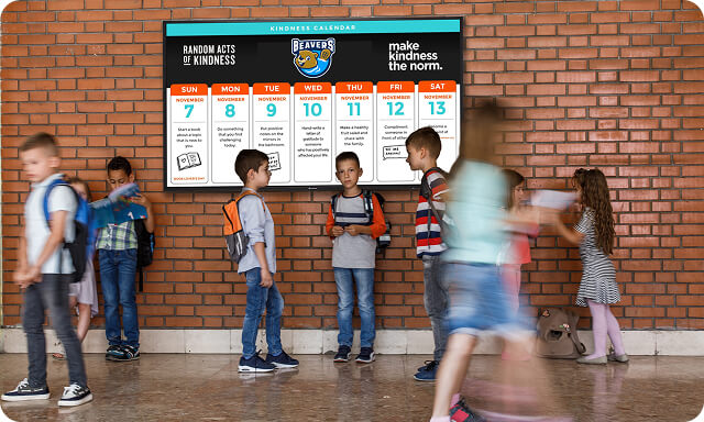 Children walking in front of a wall mounted ActivPanel D-Series